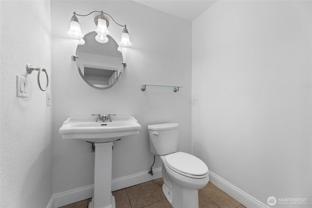 16912 49th St E, Lake Tapps, WA 98391 - half bath with toilet, tile patterned flooring, and baseboards
