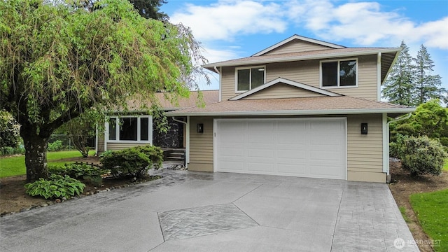 16912 49th St E, Lake Tapps, WA 98391 - view of front of property with concrete driveway, an attached garage, and a shingled roof
