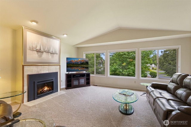 2012 Creekside Ln, Anacortes, WA 98221 - living room with carpet, a tile fireplace, lofted ceiling, and baseboards