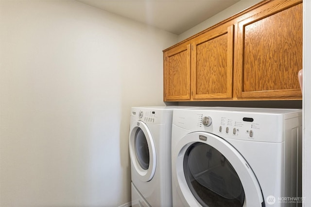 2012 Creekside Ln, Anacortes, WA 98221 - clothes washing area featuring cabinet space and washing machine and clothes dryer