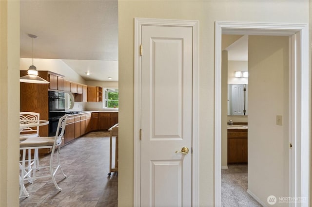 2012 Creekside Ln, Anacortes, WA 98221 - corridor featuring a sink and vaulted ceiling