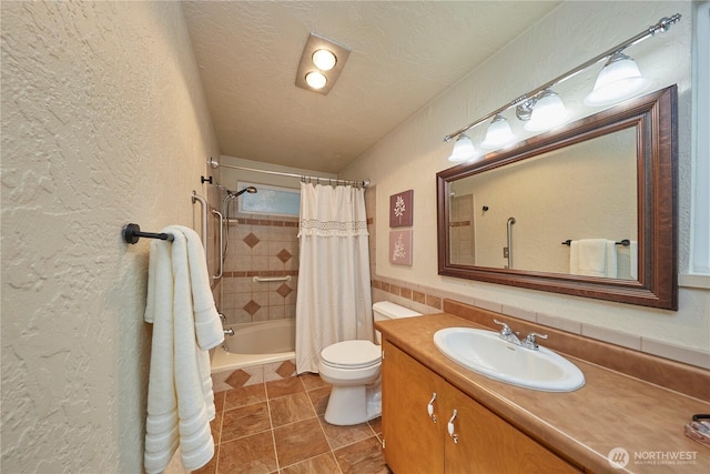 bathroom featuring a textured wall, toilet, vanity, shower / tub combo with curtain, and tile patterned floors