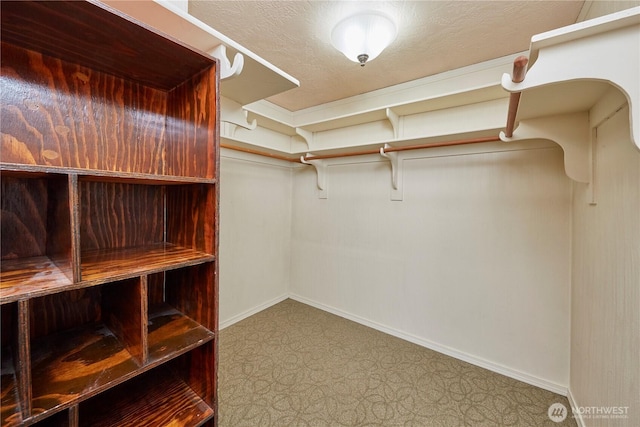 spacious closet with tile patterned floors