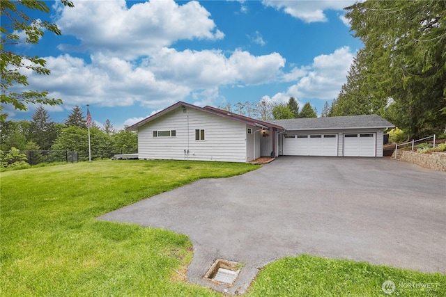 view of front facade with driveway and an attached garage