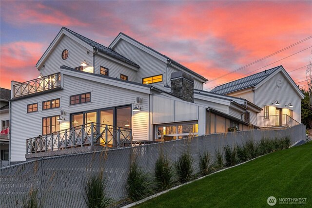 rear view of property with a balcony