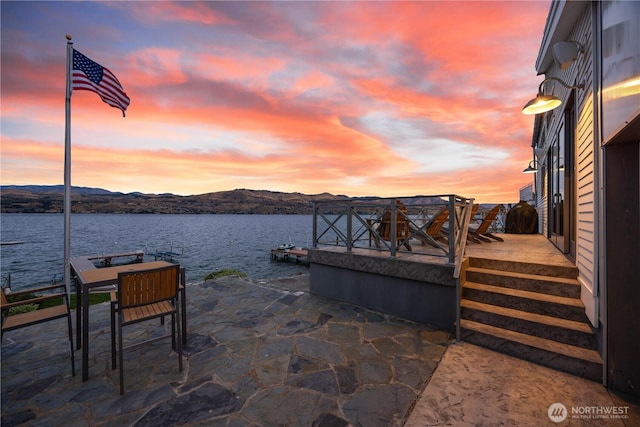 dock area featuring a water and mountain view