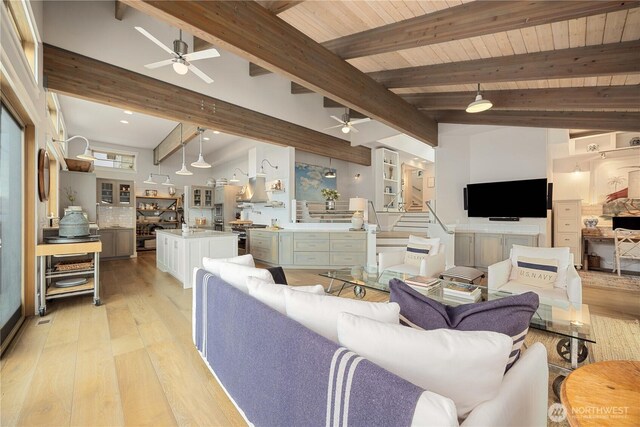 living room with ceiling fan and light wood-style floors