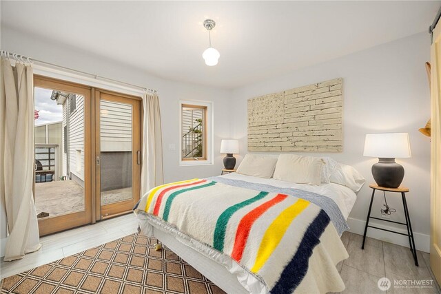 bedroom featuring access to outside and light wood-style flooring