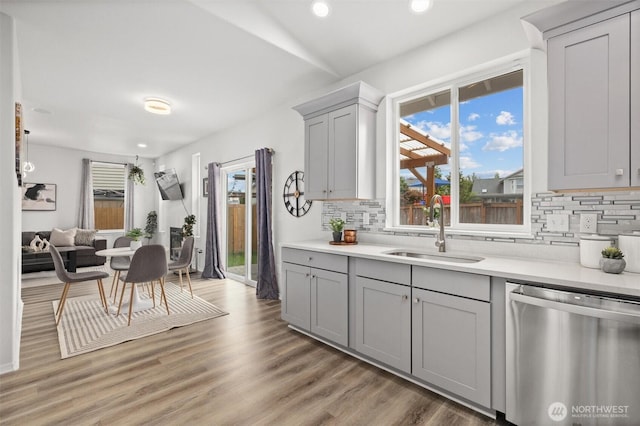 15017 46th Ave SE, Everett, WA 98208 - kitchen with stainless steel dishwasher, a sink, gray cabinetry, backsplash, and recessed lighting