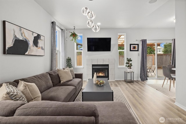 15017 46th Ave SE, Everett, WA 98208 - living room featuring light wood-type flooring, baseboards, and a fireplace
