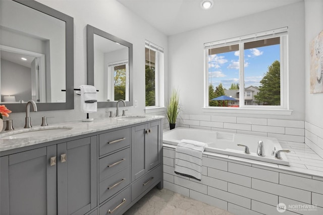 15017 46th Ave SE, Everett, WA 98208 - bathroom featuring healthy amount of natural light, a garden tub, double vanity, and recessed lighting