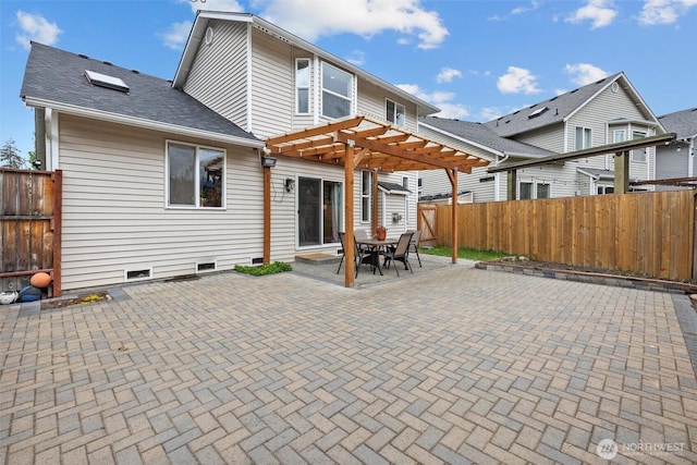 15017 46th Ave SE, Everett, WA 98208 - back of property featuring a pergola, a patio area, a fenced backyard, crawl space, and roof with shingles