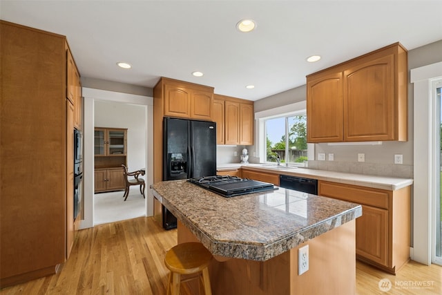1855 Shanon Ln, Enumclaw, WA 98022 - kitchen with black appliances, a sink, light wood-type flooring, light countertops, and recessed lighting