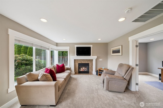 1855 Shanon Ln, Enumclaw, WA 98022 - living area featuring carpet, a fireplace with flush hearth, recessed lighting, and baseboards