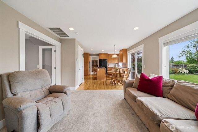 1855 Shanon Ln, Enumclaw, WA 98022 - living room with recessed lighting, light wood-type flooring, light carpet, and baseboards