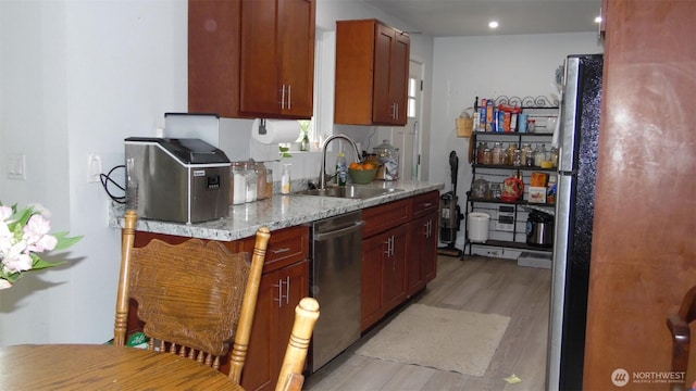 145 Collar Ave, Morton, WA 98356 - kitchen with a sink, stainless steel dishwasher, light wood-style flooring, light stone countertops, and recessed lighting