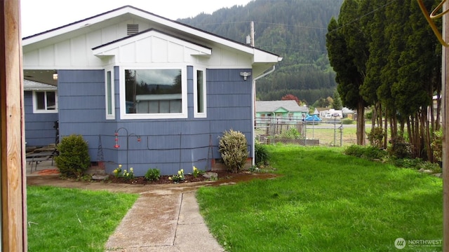 145 Collar Ave, Morton, WA 98356 - view of side of property featuring board and batten siding and a view of trees