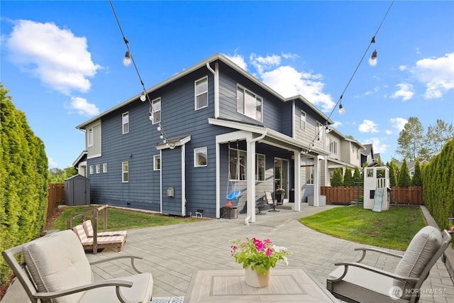 4422 Riverfront Blvd, Everett, WA 98203 - back of property featuring a shed, an outdoor structure, a patio area, and crawl space