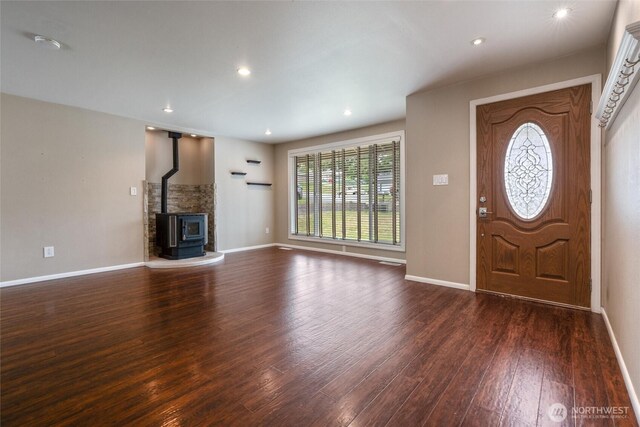 3620 Westminster Dr SE, Port Orchard, WA 98366 - entrance foyer with dark wood finished floors, baseboards, a wood stove, and recessed lighting