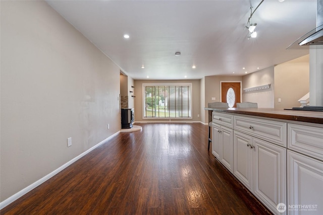 3620 Westminster Dr SE, Port Orchard, WA 98366 - unfurnished living room featuring dark wood-style flooring, baseboards, and recessed lighting