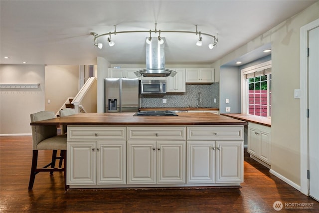 3620 Westminster Dr SE, Port Orchard, WA 98366 - kitchen with appliances with stainless steel finishes, butcher block counters, island range hood, white cabinetry, and recessed lighting