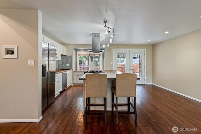 3620 Westminster Dr SE, Port Orchard, WA 98366 - dining room featuring baseboards, dark wood finished floors, and recessed lighting