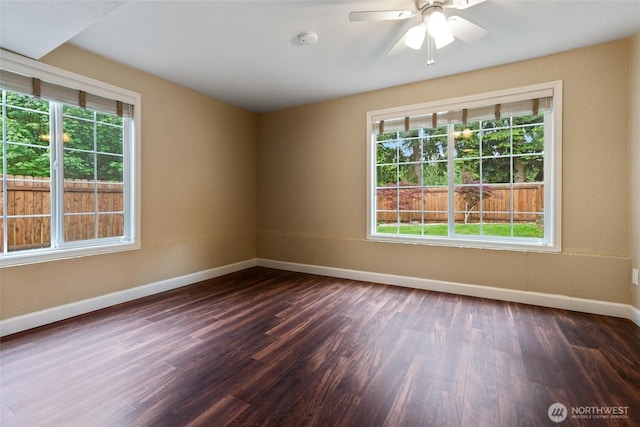 3620 Westminster Dr SE, Port Orchard, WA 98366 - spare room with baseboards, plenty of natural light, dark wood-style floors, and a smoke detector