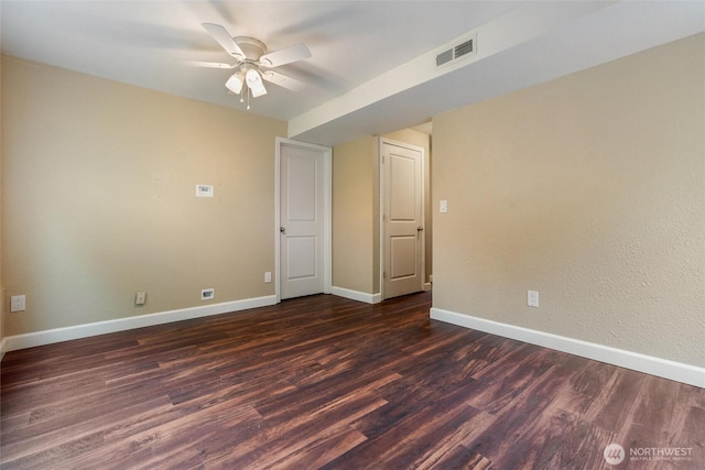 3620 Westminster Dr SE, Port Orchard, WA 98366 - empty room featuring a ceiling fan, dark wood-type flooring, and baseboards