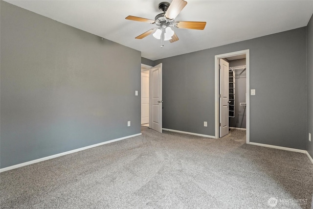 3620 Westminster Dr SE, Port Orchard, WA 98366 - unfurnished bedroom with carpet floors, baseboards, a walk in closet, and a closet