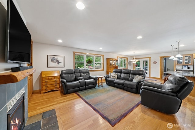39800 224th Ave SE, Enumclaw, WA 98022 - living area with a tiled fireplace, wood finished floors, baseboards, and recessed lighting