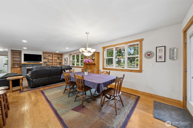 39800 224th Ave SE, Enumclaw, WA 98022 - dining space featuring light wood-style flooring, baseboards, a chandelier, recessed lighting, and built in shelves