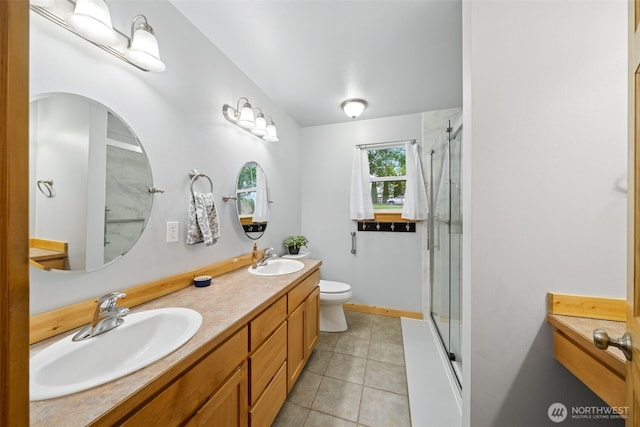 39800 224th Ave SE, Enumclaw, WA 98022 - bathroom with toilet, tile patterned flooring, double vanity, and baseboards