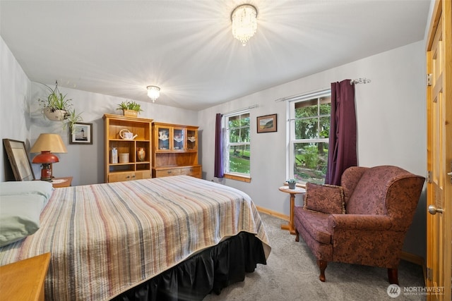 39800 224th Ave SE, Enumclaw, WA 98022 - carpeted bedroom featuring baseboards and a chandelier