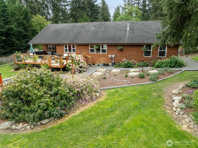 39800 224th Ave SE, Enumclaw, WA 98022 - back of house with a deck, a lawn, and a shingled roof