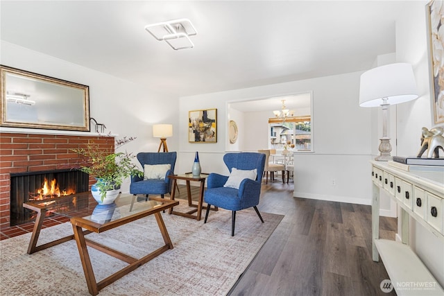 2725 165th Ave NE, Bellevue, WA 98008 - living area with wood finished floors, a brick fireplace, baseboards, and a chandelier
