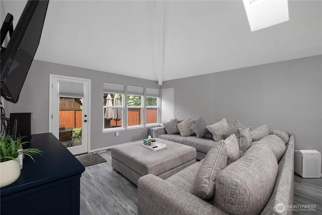 5036 Chambers Creek Loop, Olympia, WA 98501 - living area with wood finished floors, a skylight, and baseboards