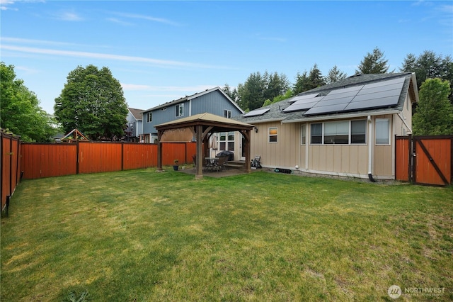 5036 Chambers Creek Loop, Olympia, WA 98501 - rear view of house featuring a gazebo, solar panels, a patio, a gate, and roof with shingles
