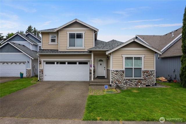 5036 Chambers Creek Loop, Olympia, WA 98501 - view of front of home with stone siding, driveway, a front yard, a shingled roof, and an attached garage