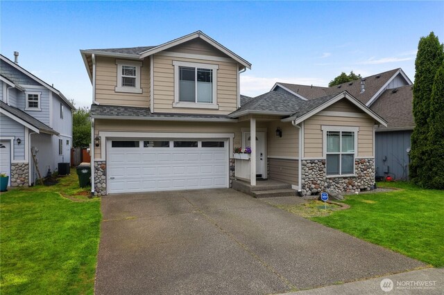 5036 Chambers Creek Loop, Olympia, WA 98501 - traditional-style house with stone siding, a garage, a front yard, and roof with shingles
