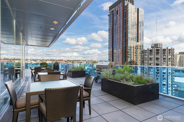 737 Olive Way Unit 2703, Seattle, WA 98101 - view of patio with grilling area and a view of city
