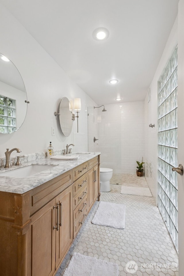 15715 249th Ave SE, Issaquah, WA 98027 - bathroom with walk in shower, toilet, and double vanity