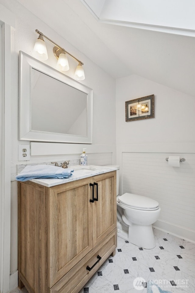 15715 249th Ave SE, Issaquah, WA 98027 - bathroom featuring toilet, vaulted ceiling, and vanity