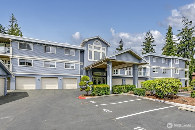 8260 53rd Ave W Unit 208, Mukilteo, WA 98275 - view of property featuring uncovered parking
