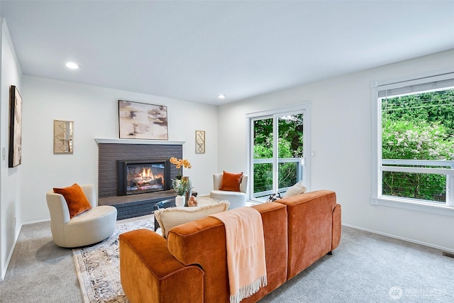 living room with carpet floors, a fireplace, healthy amount of natural light, and recessed lighting