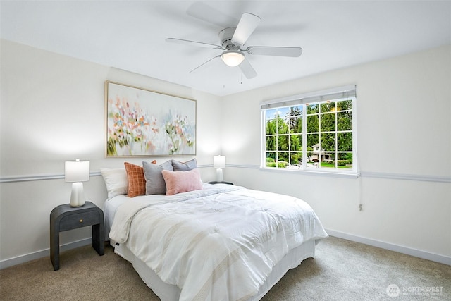 bedroom with carpet flooring, baseboards, and a ceiling fan