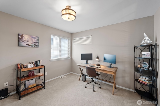 carpeted office with baseboards
