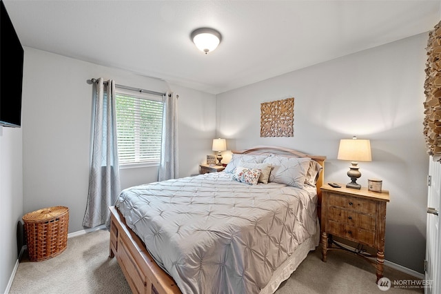 carpeted bedroom with baseboards