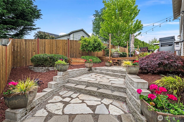 fenced backyard with a patio area