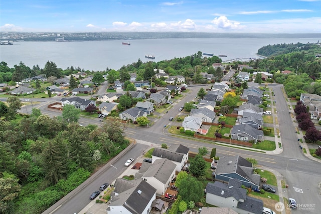 view of property location with nearby suburban area and a large body of water