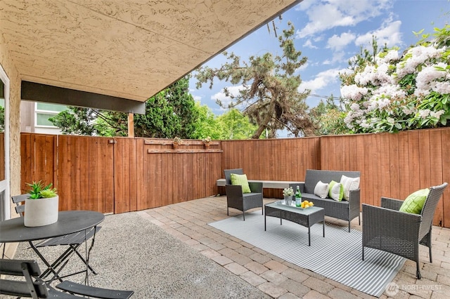view of patio with a fenced backyard and an outdoor hangout area